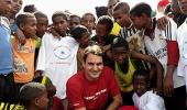 Federer plays big brother to village kids at charity event