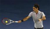 Federer puts journeyman Jaziri in his place after blip