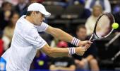 Isner survives opening Delray test, Nishikori quits