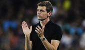 Barca coach Vilanova returns to work after cancer surgery