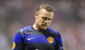 Rooney return from knee injury delayed