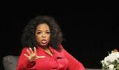 Incredulous Oprah sheds trademark warmth for Armstrong