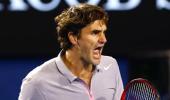 PHOTOS: Federer schools Raonic to reach last eight