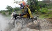 PHOTOS: Daredevil scooter riders reign in the rain