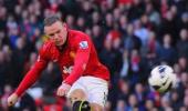 Wenger admits interest in signing Rooney, Fabregas