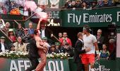 Protestor with a flare interrupts French Open final