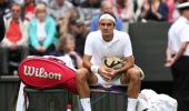 Down but not out, declares Federer