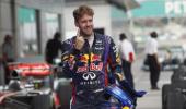 Vettel secures pole at rain-hit Sepang