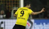 Lewandowski hat-trick helps Dortmund crush Stuttgart