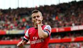 EPL PHOTOS: Superb Wilshere puts Arsenal back on top of table