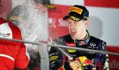 Formula One: Vettel cruises to Singapore treble