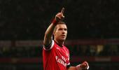 EPL PHOTOS: Podolski puts Arsenal back into contention for CL slot