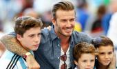 Soccer star Beckham and son 'shaken' after car crash