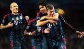 Champions League: Bayern win at Arsenal, Atletico beat Milan