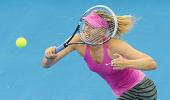 Sharapova fights back against Estonian, to meet Serena in Brisbane semis