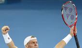 Hewitt grinds down Federer to clinch Brisbane title