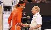 PHOTOS: Federer trades shots with hero Rod Laver for charity