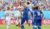 Godin header puts Uruguay in last 16 and Italy out