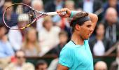 French Open Photos: Nadal gains momentum, Ferrer eases through