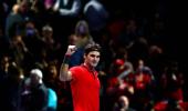 Old master Federer tames Nishikori at Tour Finals