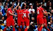 EPL PHOTOS: 'Lucky' Liverpool strike late to down QPR on dramatic weekend