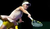 Wozniacki outlasts erratic Sharapova in WTA Finals