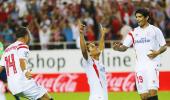 La Liga: Sevilla climb to summit, Atletico win