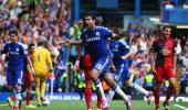 Costa hat-trick downs Swansea, City draw at Arsenal