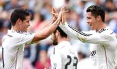 La Liga: Ronaldo treble as Real hit eight, Atletico held