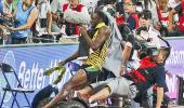 Champ Usain Bolt knocked down by photographer on Segway scooter!