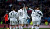 Benzema double sends Real four points clear