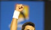 Djokovic fends off Muller to reach quarter-finals