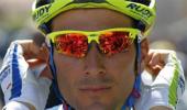 Italian Basso quits Tour de France due to testicular cancer