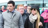 PIX: Golfer McIlroy walks hand-in-hand with girlfriend