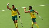 Australia thrash India to top Pool A