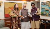 Paes, Hingis present PM Modi with autographed racquets