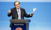 Platini re-elected as Blatter sits through criticism