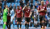 PHOTOS: QPR down after City mauling, Liverpool held