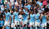 Man City flex muscles as English clubs break spending record