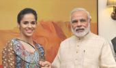 First Look: Saina presents her racquet to PM Modi