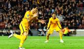 Champions League PIX: Barca beat 10-man Atletico; Bayern edge Benfica