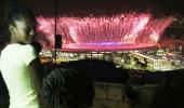 In favela above opening ceremony, pride and disappointment