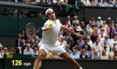 PHOTOS: Federer storms into quarters, Nishikori retires with injury