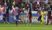 La Liga: Atletico's loss steers Barcelona closer to title