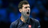 PHOTOS: Djokovic digs deep to repel Raonic onslaught