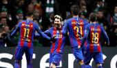 PHOTOS: Messi double lifts Barcelona, Man City advance