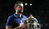 Cilic wins Basel title, edges nearer ATP Finals spot