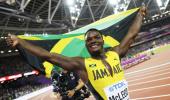 World C'ships PIX: McLeod wins hurdles; Rojas puts Venezuela on map