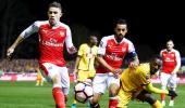 FA Cup: 100th goal for Walcott as Arsenal end Sutton's dream run