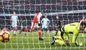 EPL PHOTOS: Ten-man Arsenal win thriller; Chelsea stretch lead